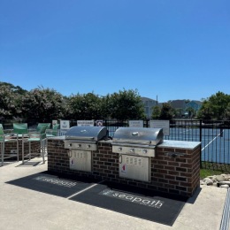 grills outdoors by a pool