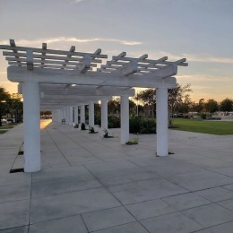 a stone path with a white structure